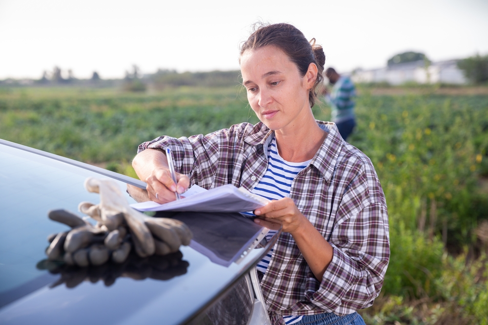Farmer Reviewing documents